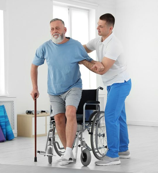 Physiotherapist Helping Older Man — Health Specialists on Fraser Coast, QLD