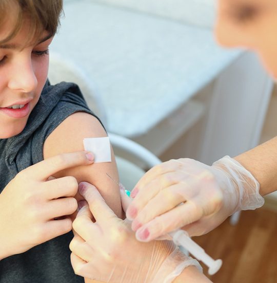 Kid Receiving Needle — Health Specialists on Fraser Coast, QLD