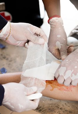 Bandaging Injured Arm — Health Specialists on Fraser Coast, QLD