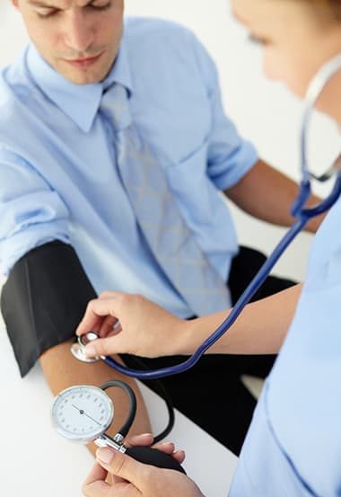 Doctor Checking Blood Pressure — Health Specialists on Fraser Coast, QLD